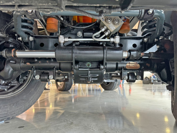 Die Schraubenfedern der kommunalen Maschine Multicar M41 sorgen für hohen Fahrkomfort und Sicherheit.